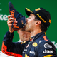 Daniel Ricciardo of Australia and Red Bull Racing celebrates on the podium with a shoey during the Formula One Grand Prix of China.